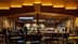Interior view of a Starbucks coffee shop with a counter and seating area. - Olive Oil Times