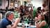 A couple sitting at a table in a restaurant, engaged in conversation while dining. - Olive Oil Times