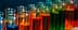 Row of test tubes filled with various colored liquids in a laboratory setting. - Olive Oil Times
