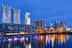 Night view of Buenos Aires cityscape with skyscrapers and waterfront reflections. - Olive Oil Times