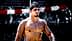 Shirtless male athlete with short dark hair standing outdoors, looking to the side. - Olive Oil Times