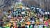 A large crowd of demonstrators with tractors and flags participating in a protest. - Olive Oil Times