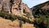 Rocky terrain featuring steep cliffs and scattered trees in a natural setting. - Olive Oil Times